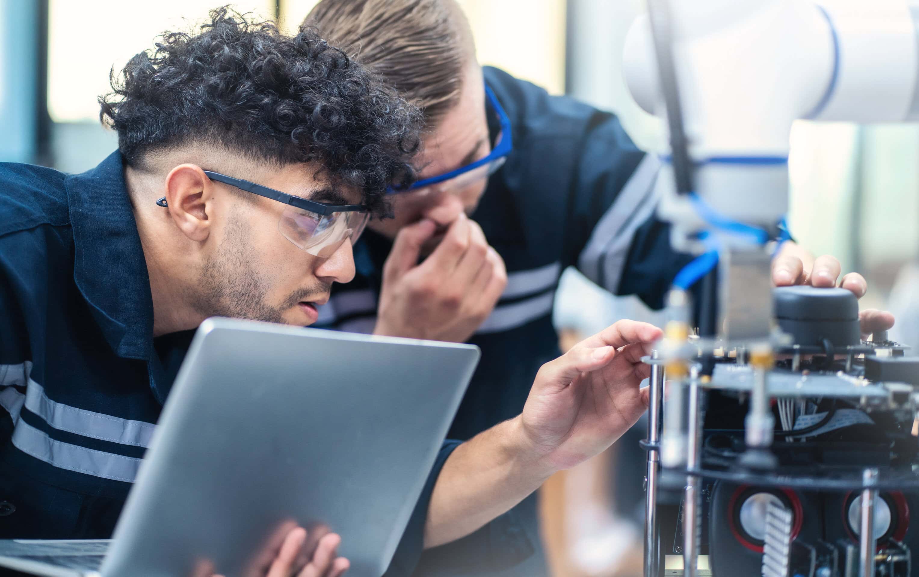 Mechanical engineering team working in robotic technology lap for research and develop for manufacturing automation and robotics.